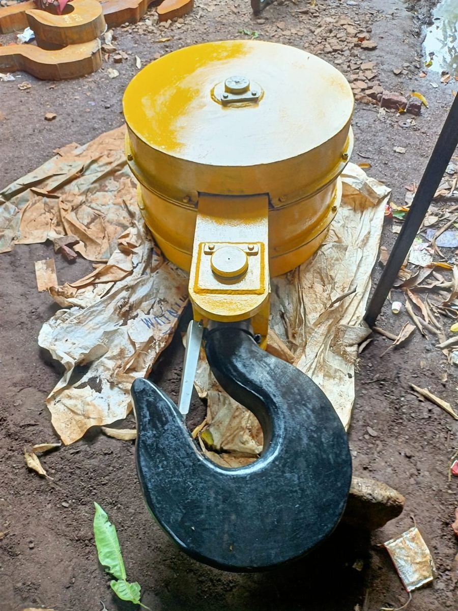 Yellow EOT crane bottom block with black hook