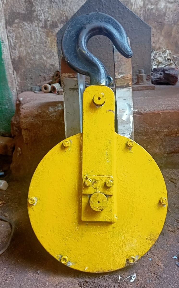 Yellow single-sheave pulley block with black hook
